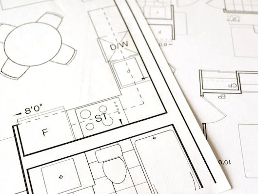 Plattegrond van een woning met indelingen voor kamers en meubels.
